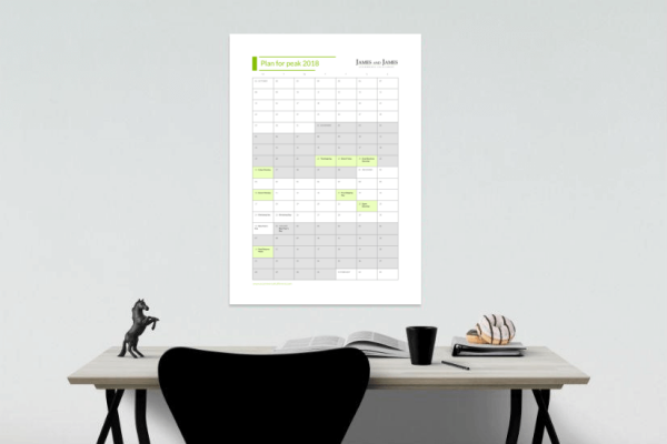 A wall planner above a desk, highlight all of the key shopping days in the retail holiday calendar.