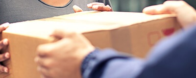 People handling a box