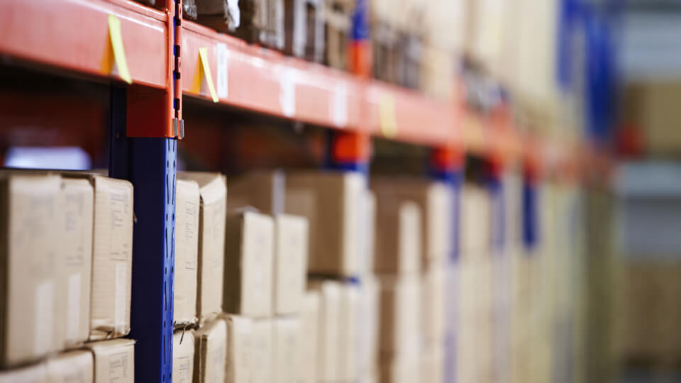 Stock packaged and stacked within a fulfilment centre ready for shipping