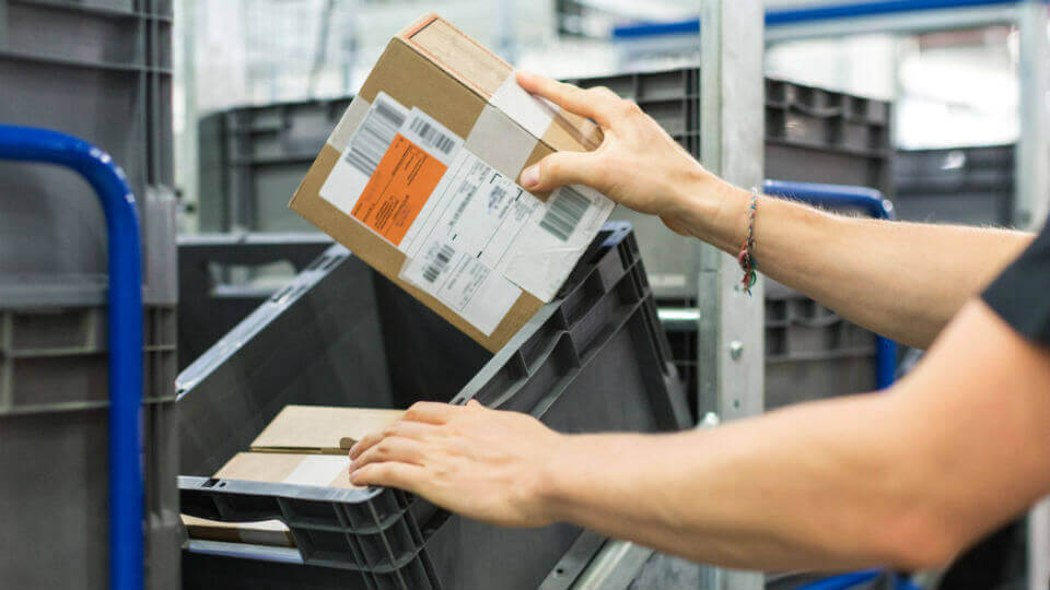 Shipping: a parcel is place into a container, as part of the order fulfillment process