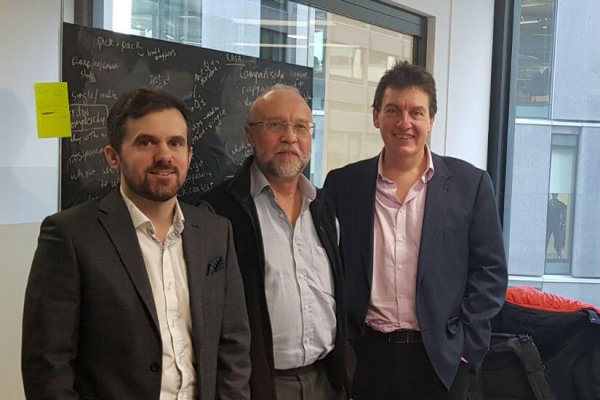 James Hyde, Dr Phil Godsiff and Professor Roger Maull in front of a chalkboard discussing variety in the pick and pack process