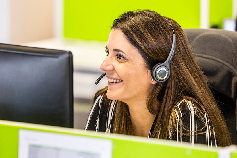 Maria - one of our eCommerce fulfilment team members - talking to a client on a headset