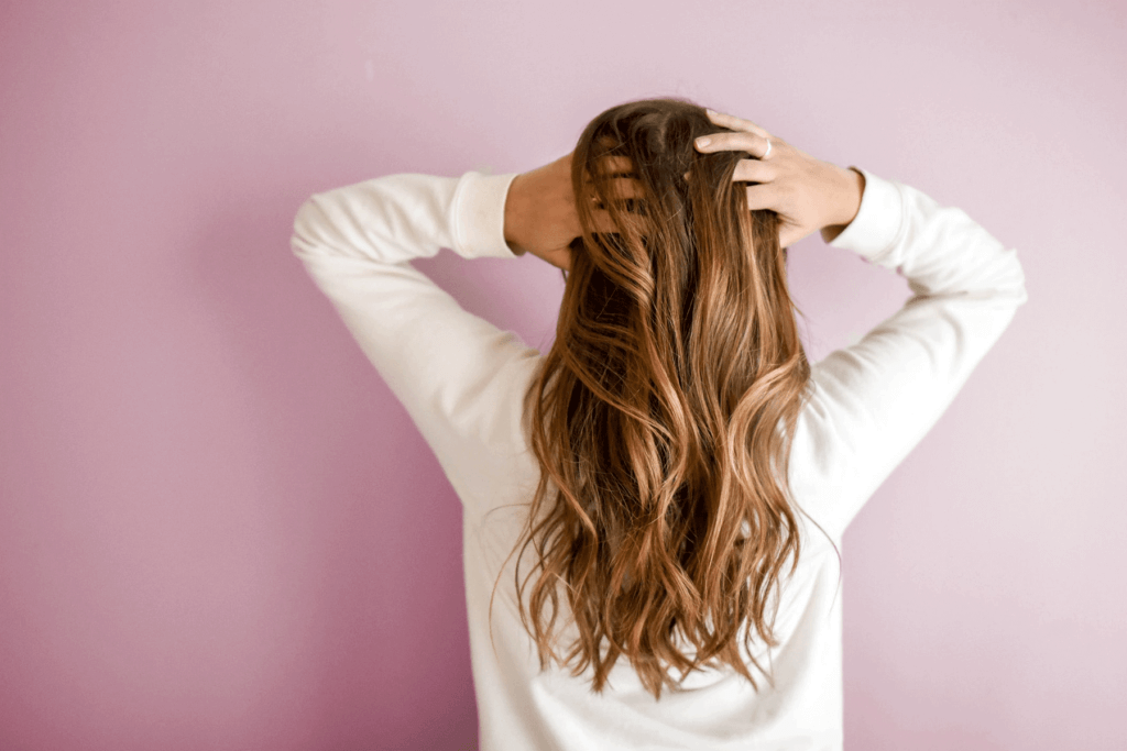 Woman running hand in hair