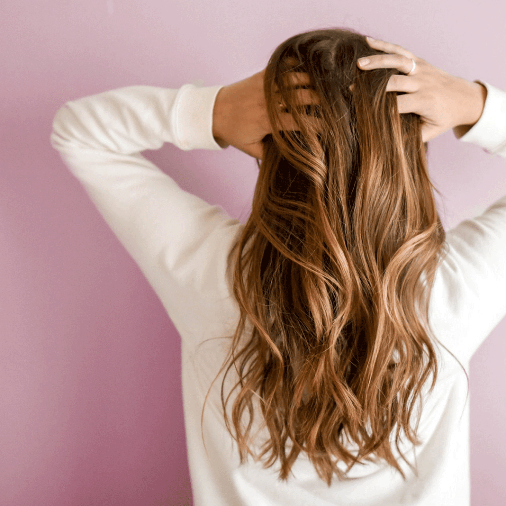 Woman running hand in hair