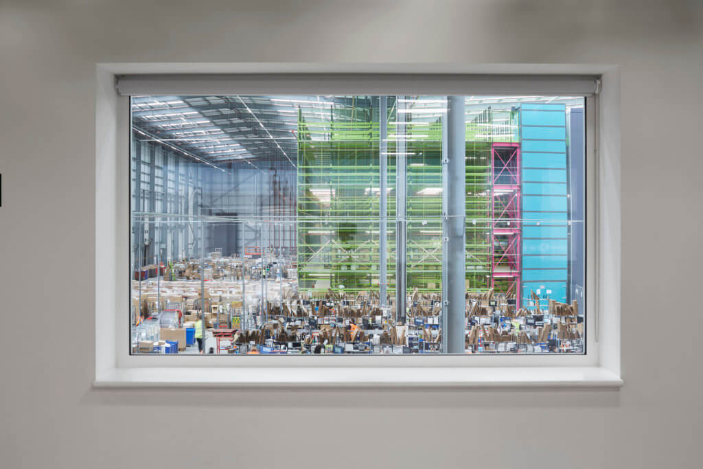 A view of James and James Fulfilment Centre operations through a window