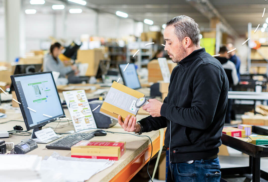 Person at desk packing orders